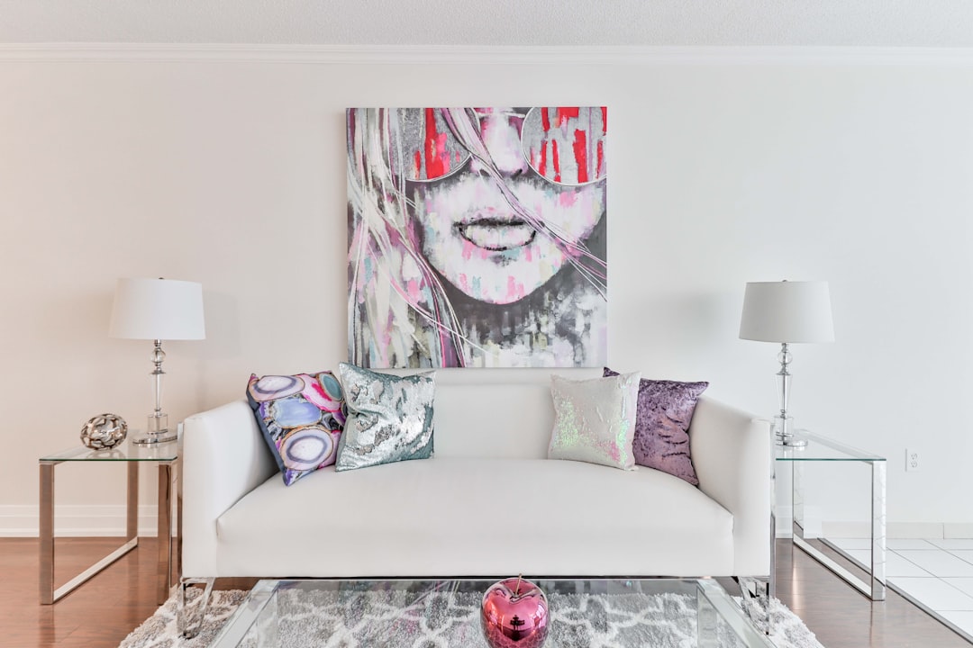 A professionally staged, bright, and modern living room with clean lines and stylish furniture, showcasing how interior presentation can maximize a home's sale price.